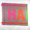 Brightly coloured patterned scarf with HAPPY motif, in grey, pink, orange, lilac and green.jpg