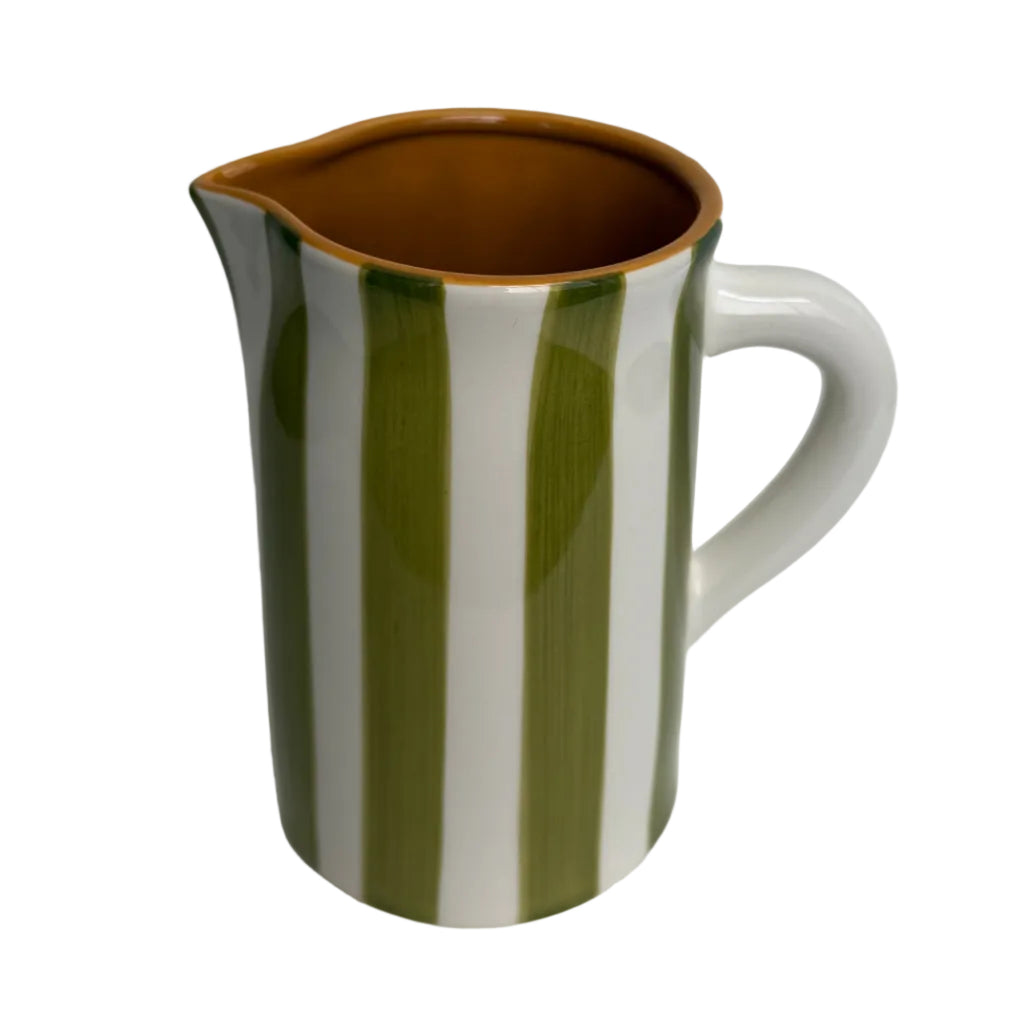 Ceramic pitcher with green and white stripes on a gray background