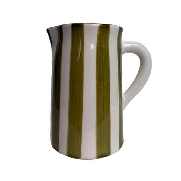 Ceramic pitcher with green and white stripes on a gray background
