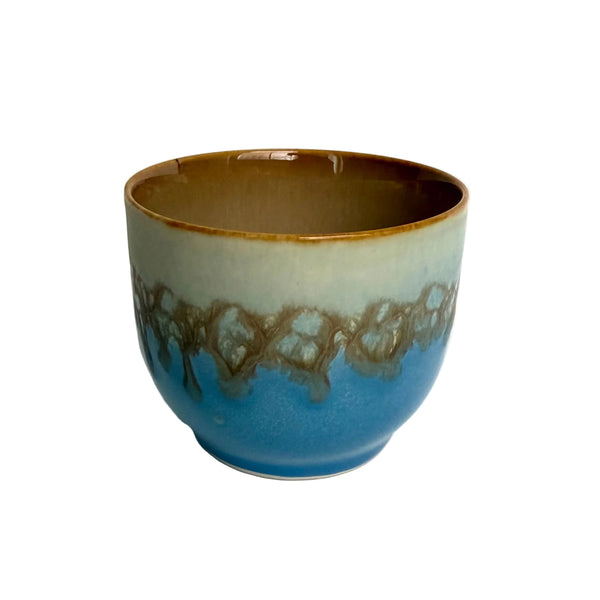 HK Living Ceramic cup with marbled design on a white background