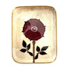Decorative tray with a red rose design on a beige background