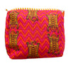 Fabric with tiger pattern on a pink and orange zigzag background