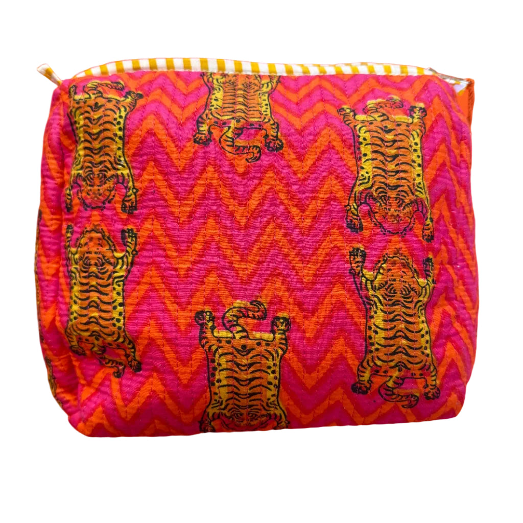 Fabric with tiger pattern on a pink and orange zigzag background