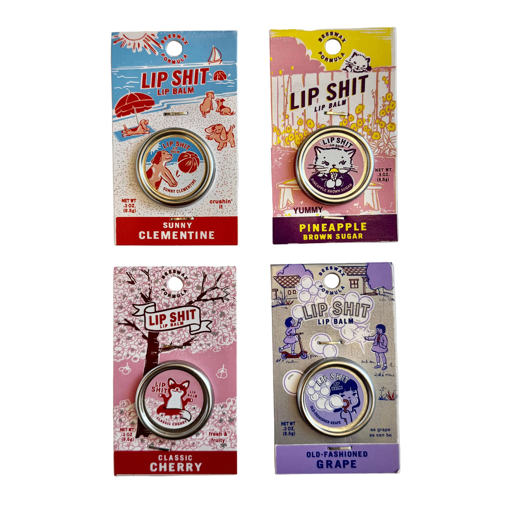 Incognito Four packages of 'Lip Shit' lip balm with colorful designs and text on a light gray background.