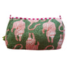 Green floral-patterned pouch on an orange background