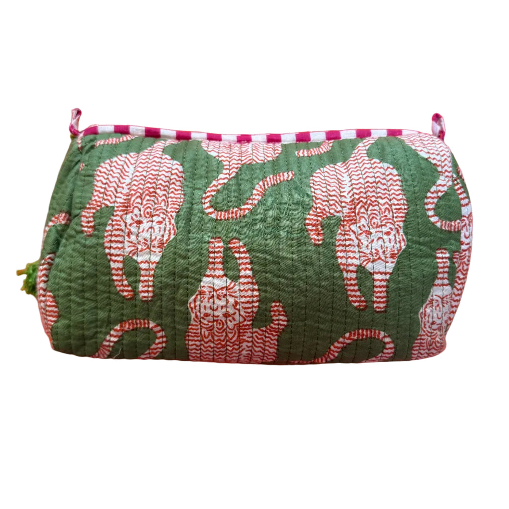 Green floral-patterned pouch on an orange background