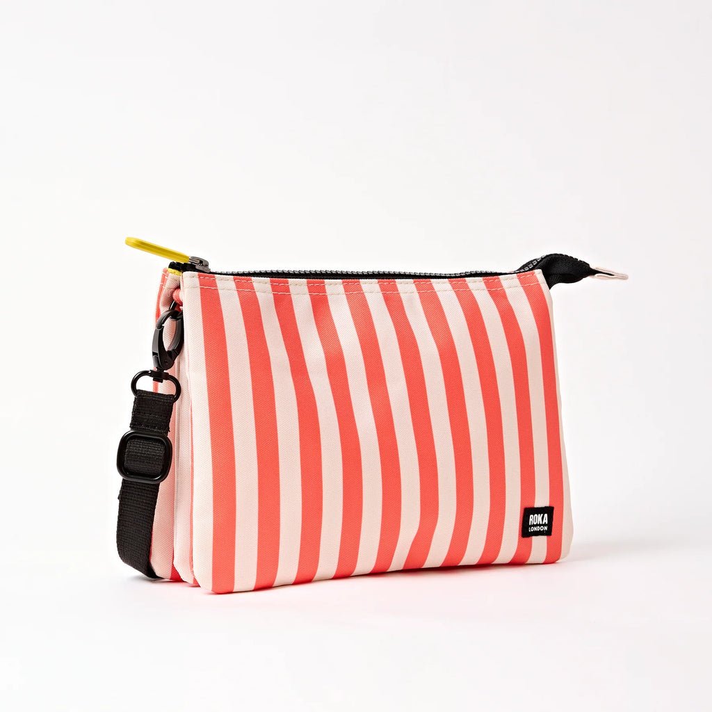 Roka Red and white striped bag with a black strap on a white background