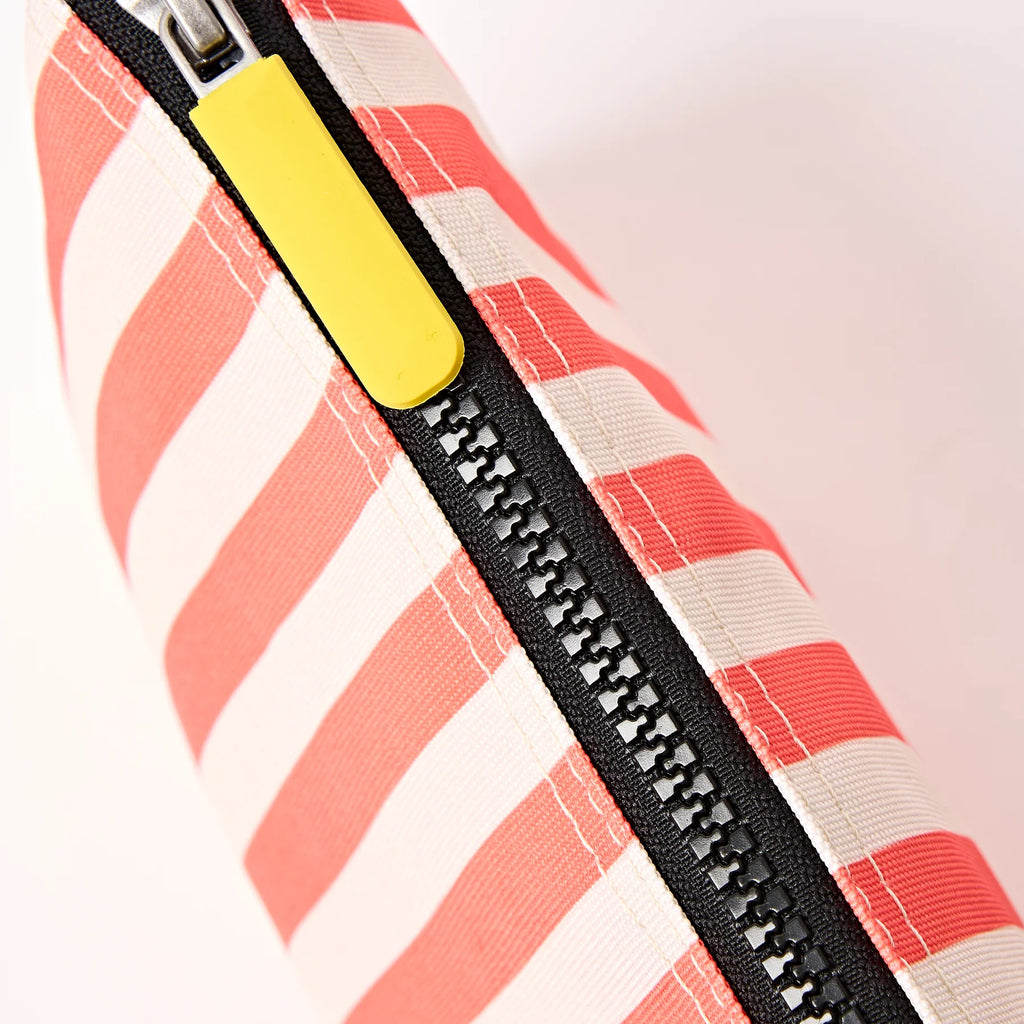 Roka Close-up of a striped bag with a yellow zipper on a white background