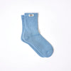 Roka Blue sock with a brand label on a white background