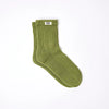 Roka Green sock with a brand label on a white background