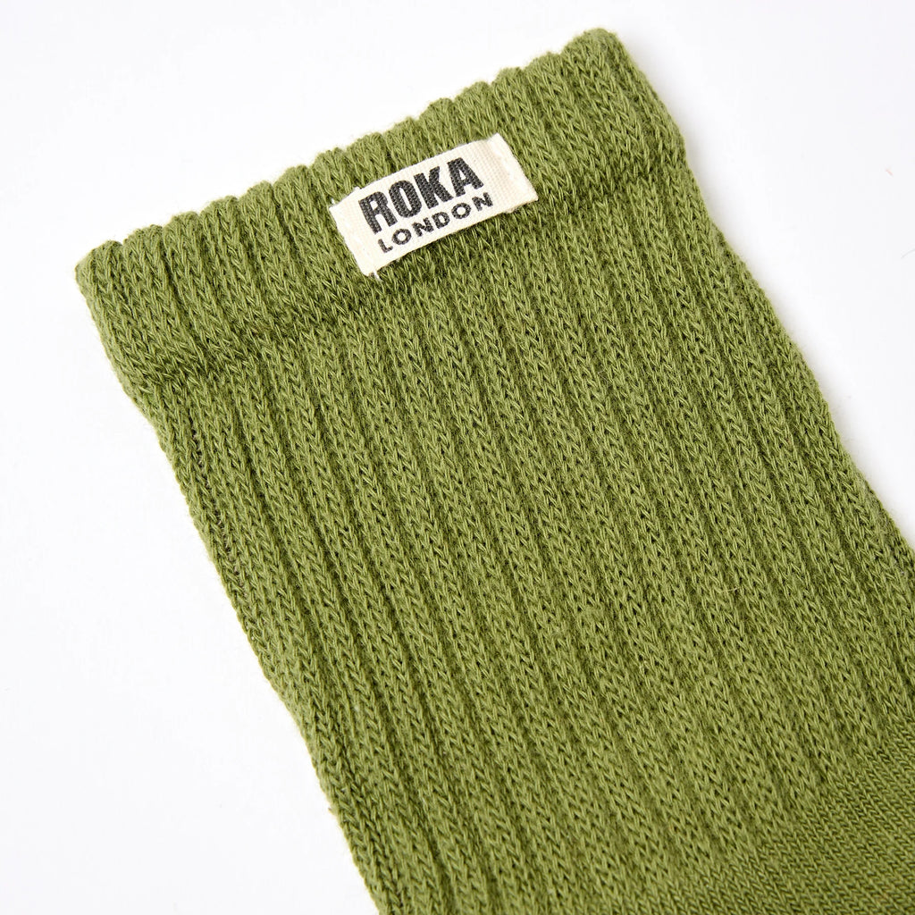 Roka 
Green sock with Roka London label on a white background