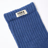Roka Blue sock with Roka London label on a white background