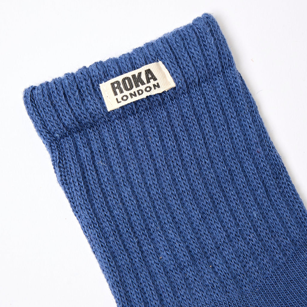 Roka Blue sock with Roka London label on a white background