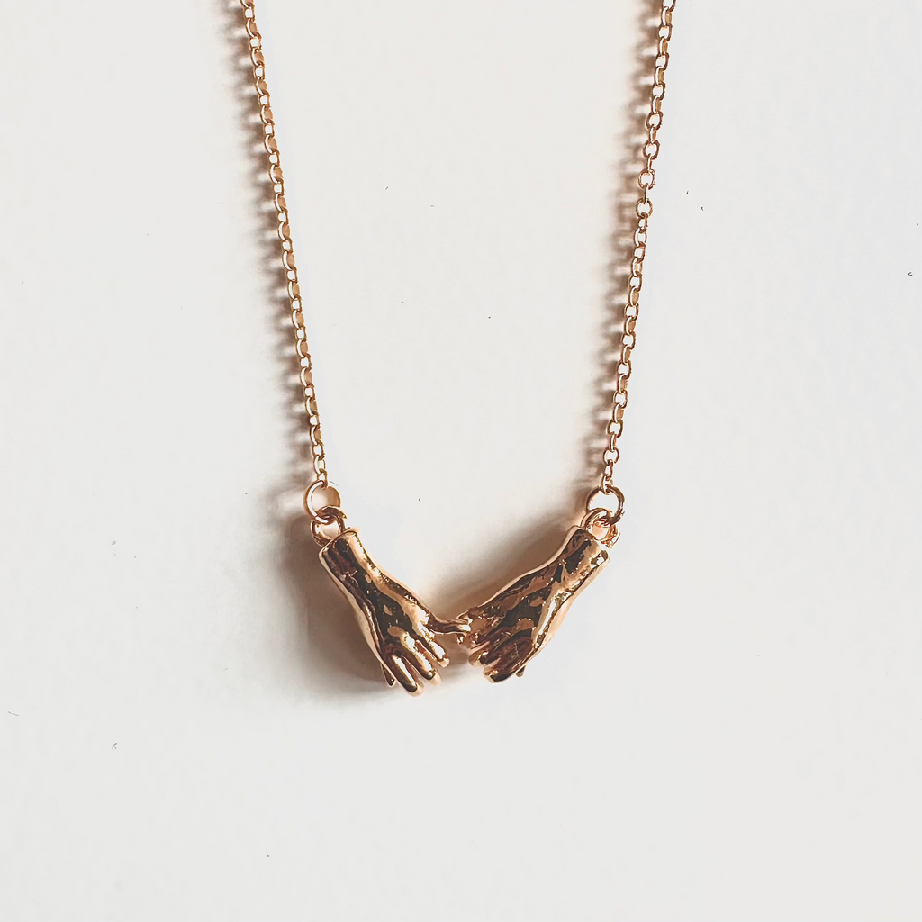 Scream Pretty Gold Linked Hands Necklace.jpg