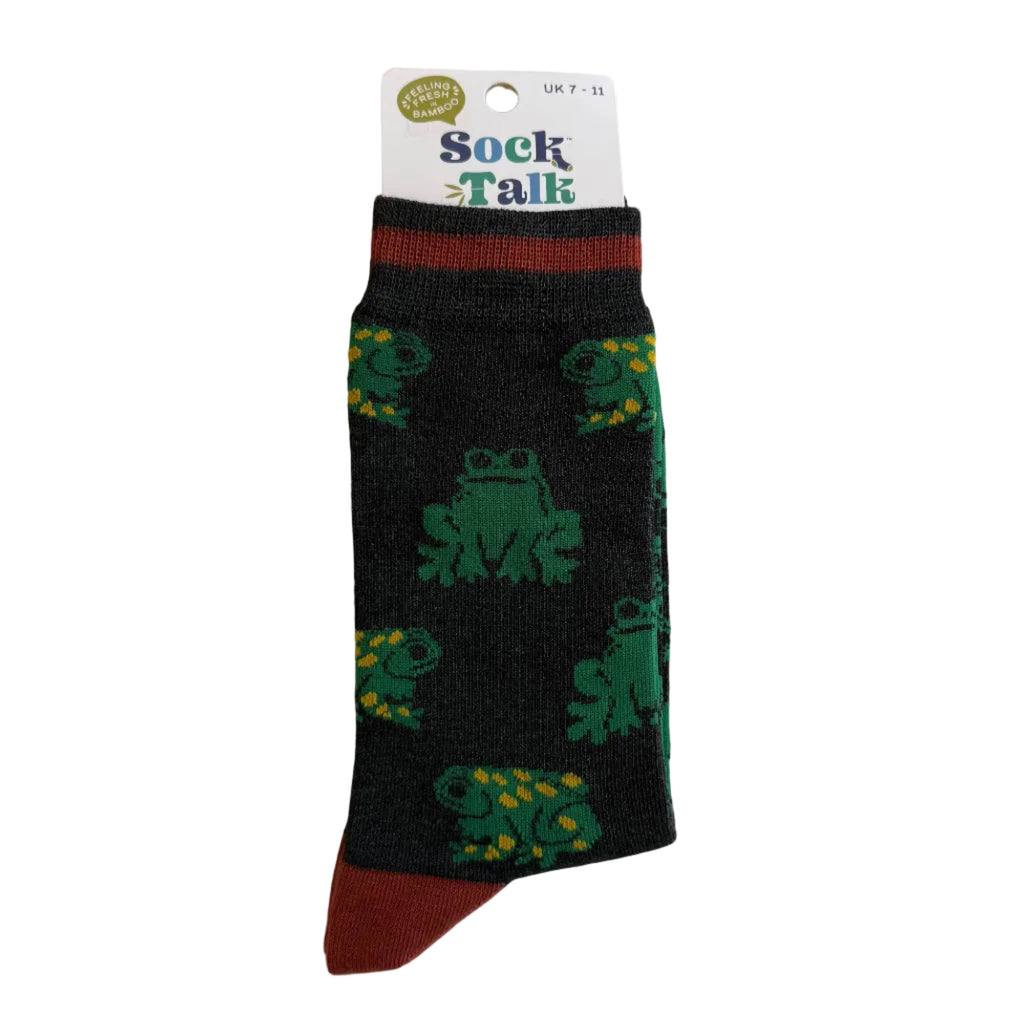 Black sock with green frog patterns on a white background