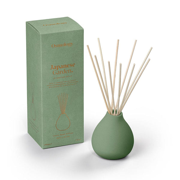 Osmology Japanese garden Green diffuser with reeds and packaging labeled 'Japanese Garden' on a white background