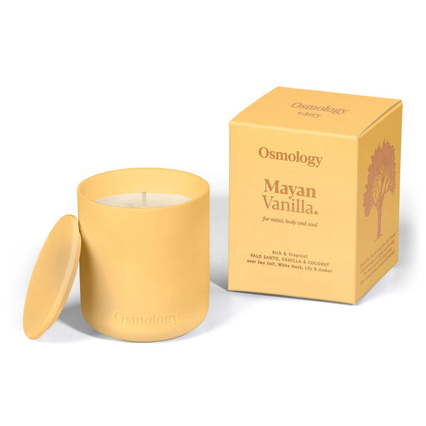 osmology  mayan vanilla Yellow candle with lid and matching packaging box on a white background