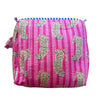 Pink pouch with cheetah pattern on a red background