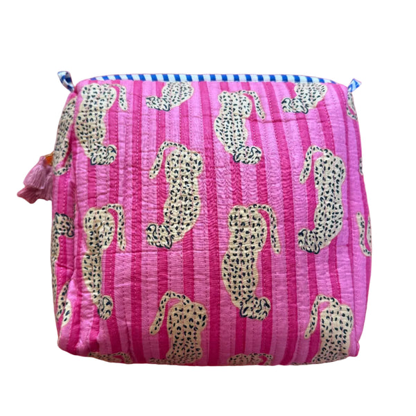 Pink pouch with cheetah pattern on a red background