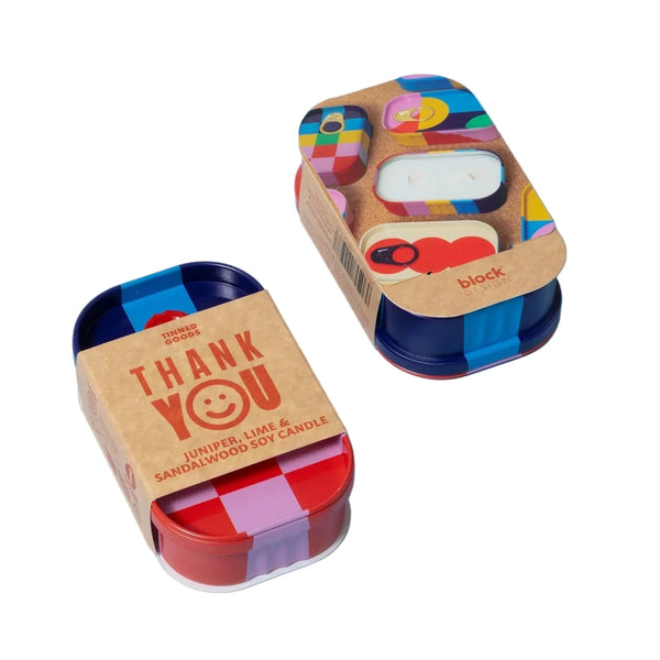 Block Design Thank You colorful candle containers with cardboard lids on a light blue background