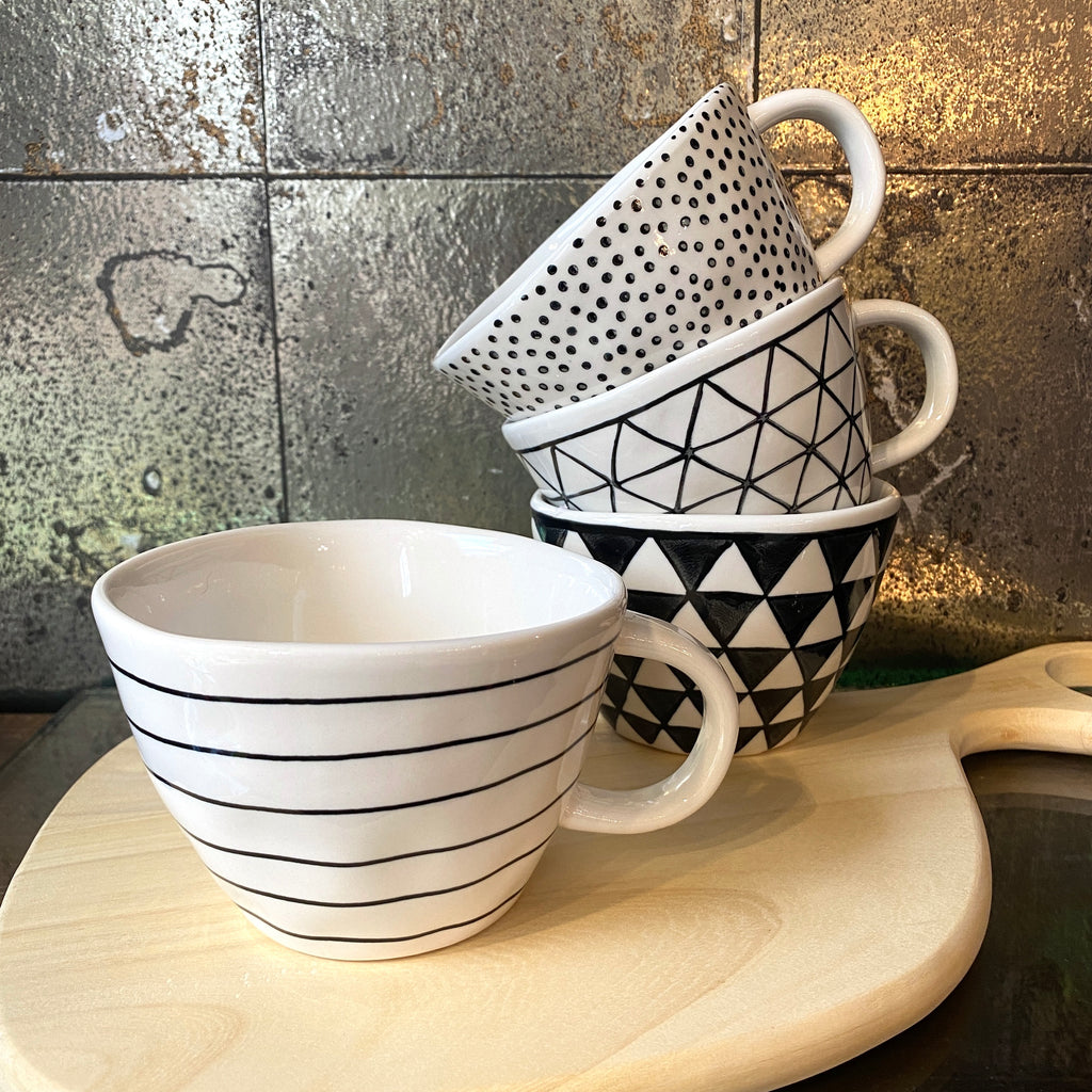 Stoneware cream and black spotty mug. jpg