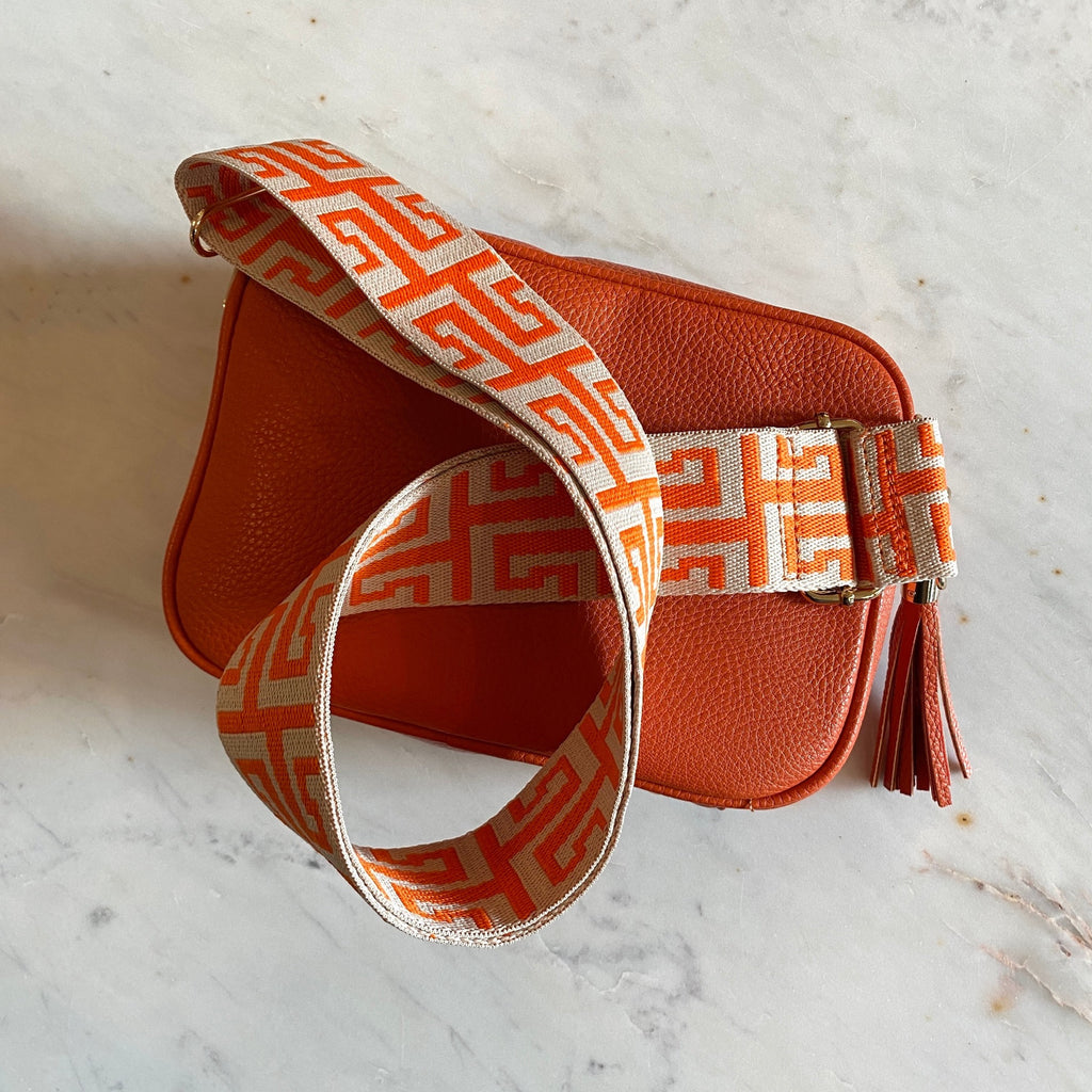Orange Leather Cross Body Bag With Patterned Strap And Leather Tassel.jpg