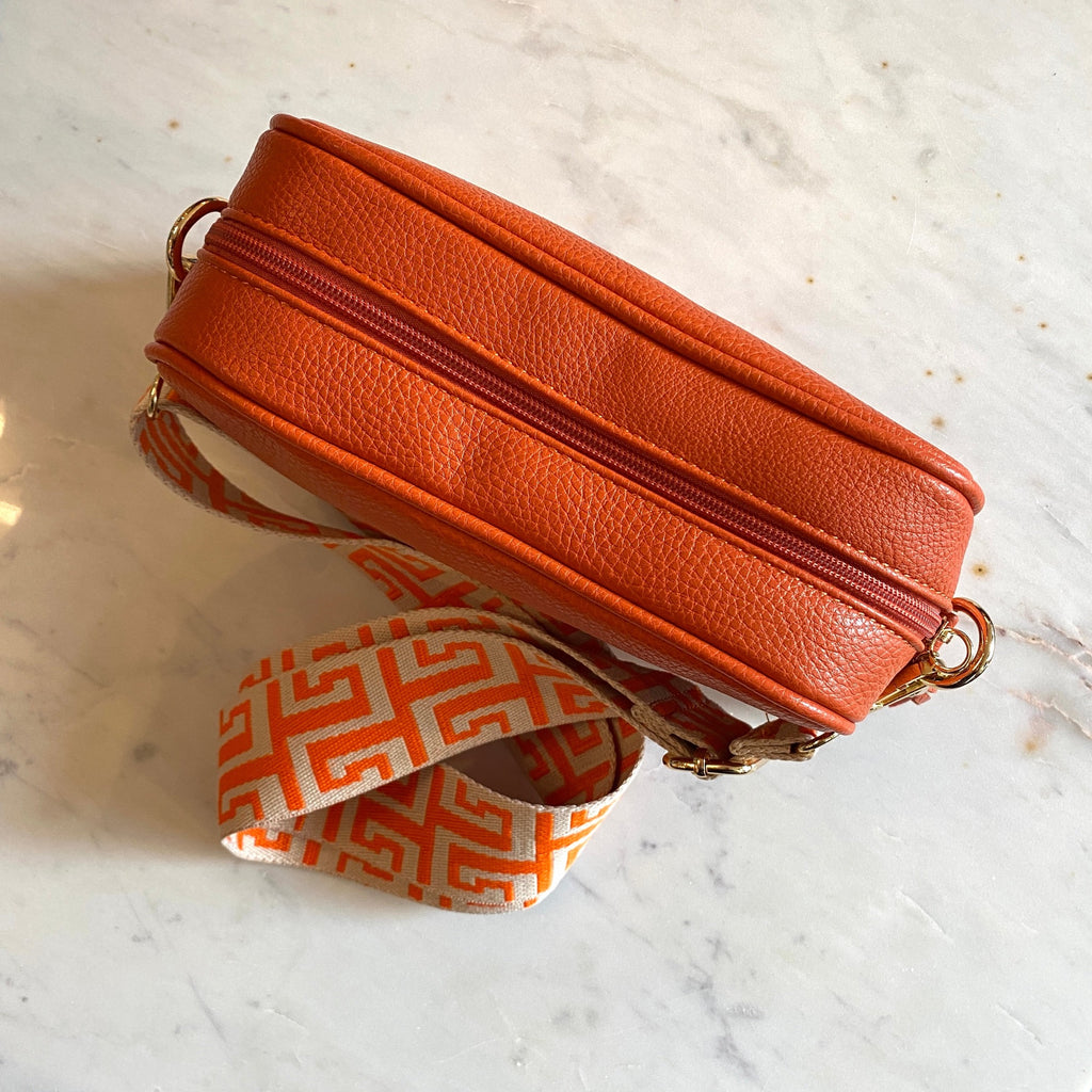 Orange Leather Cross Body Bag With Patterned Strap And Leather Tassel. .jpg