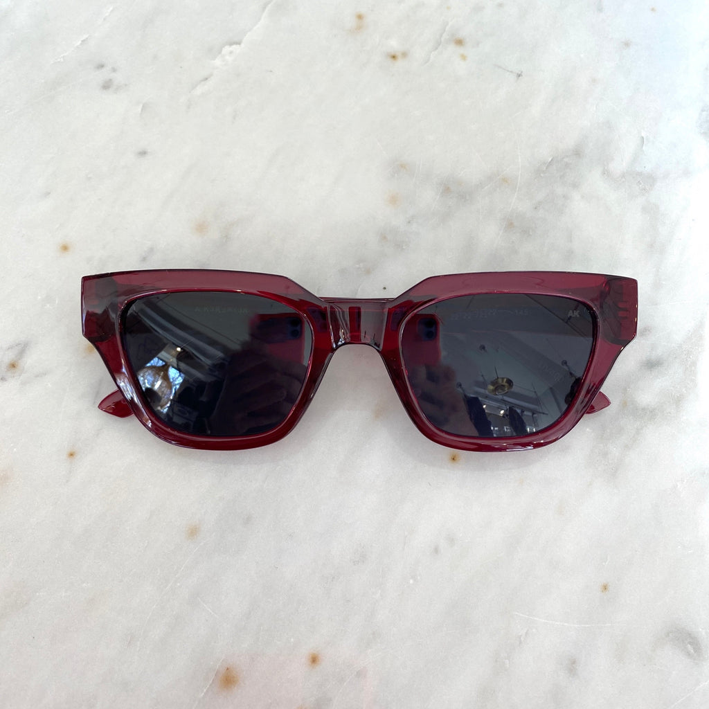 Kaws Sunglasses By A. Kjaerbede Burgundy Transparent .jpg