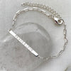 Peace and love sterling silver bar bracelet with cable chain.