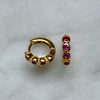 Scream Pretty bezel gold huggie earrings with ruby pink cubic zirconia stones.jpg